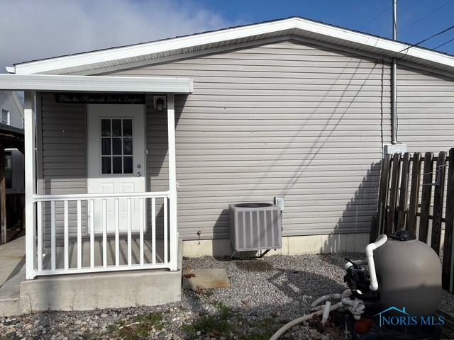 view of side of property featuring cooling unit