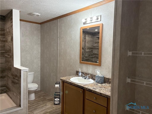 bathroom with walk in shower, a textured ceiling, toilet, vanity, and ornamental molding