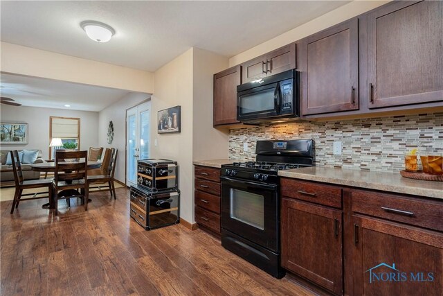 kitchen with black appliances, dark brown cabinets, dark hardwood / wood-style flooring, and tasteful backsplash