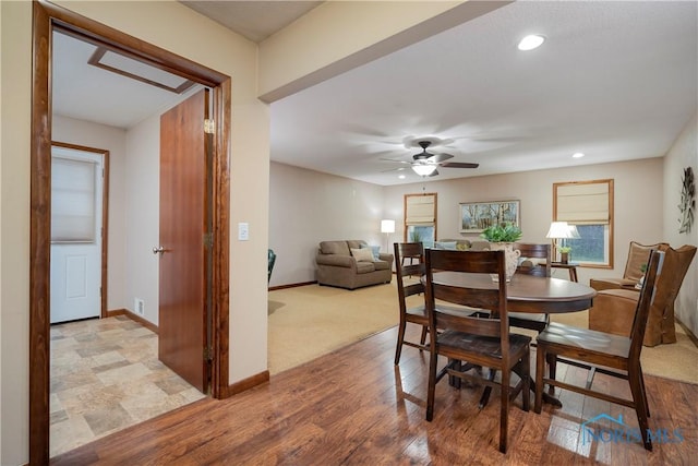 dining area featuring hardwood / wood-style floors and ceiling fan