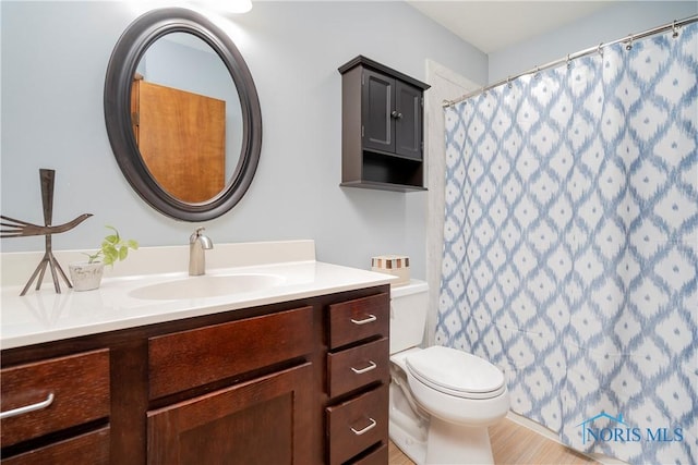 bathroom with vanity and toilet