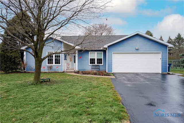 single story home with a garage and a front lawn