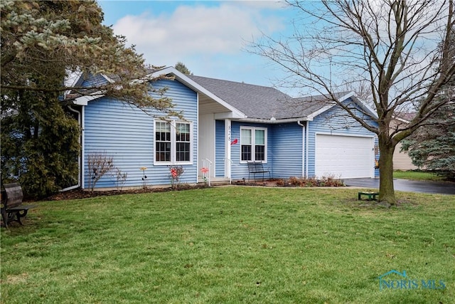 ranch-style home with a garage and a front yard