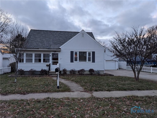 view of front of house with a front yard and a garage