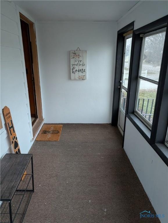 unfurnished sunroom featuring plenty of natural light