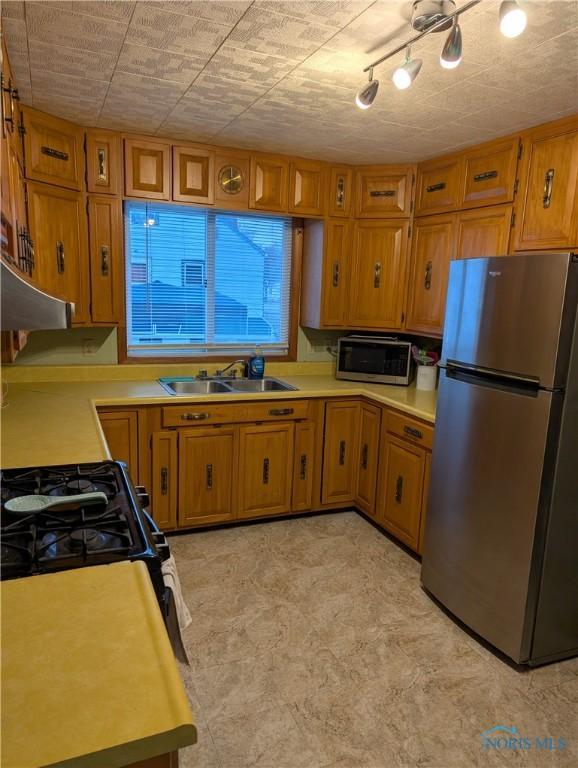 kitchen featuring sink and appliances with stainless steel finishes