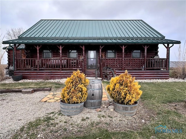 log home with covered porch