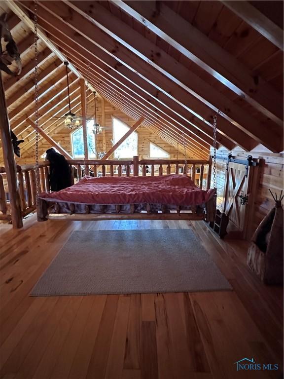 attic featuring an upstairs landing