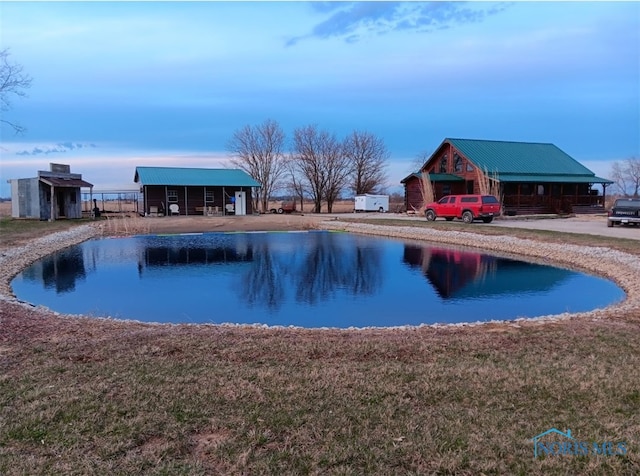 view of swimming pool with a lawn