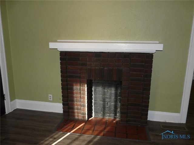 interior details with hardwood / wood-style flooring and a fireplace