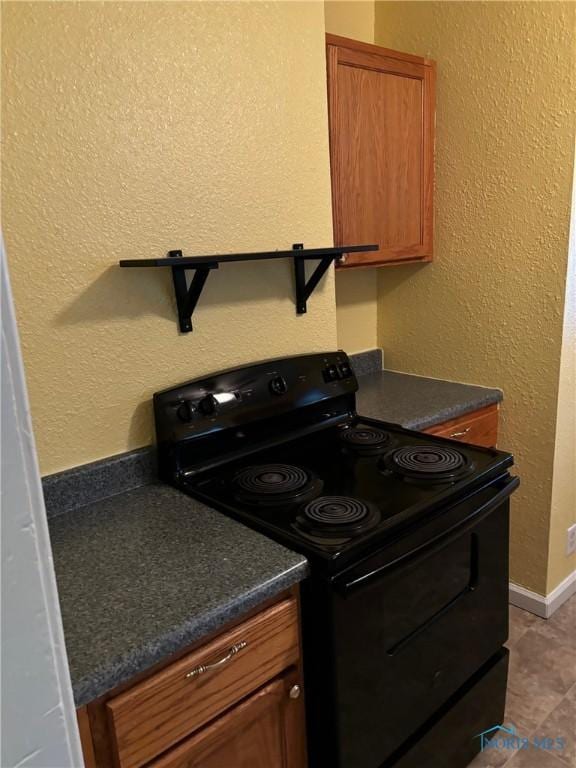 kitchen with black range with electric cooktop