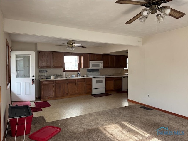 kitchen featuring white appliances and ceiling fan