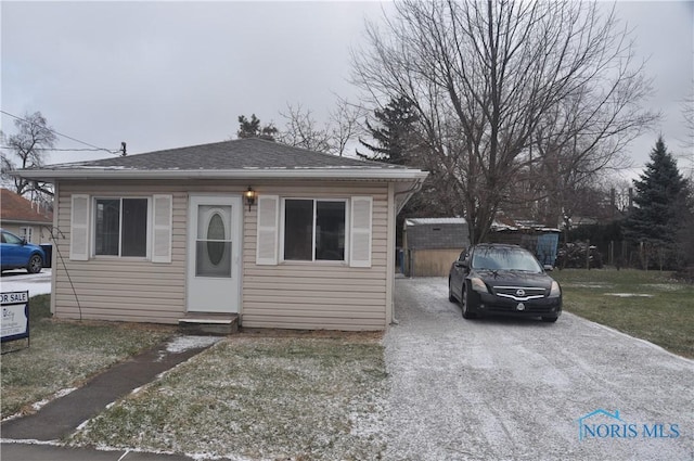 bungalow with a front lawn