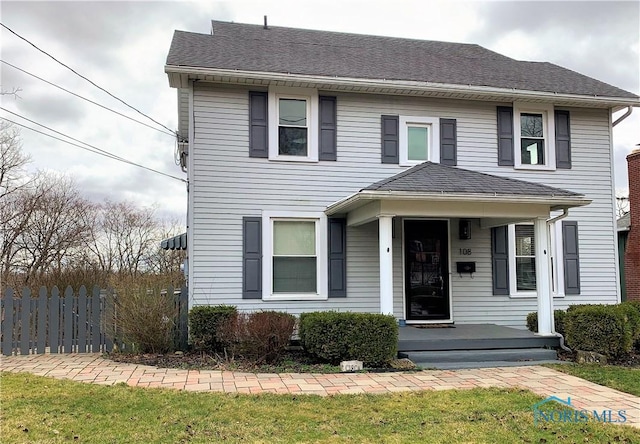 front facade with a front yard