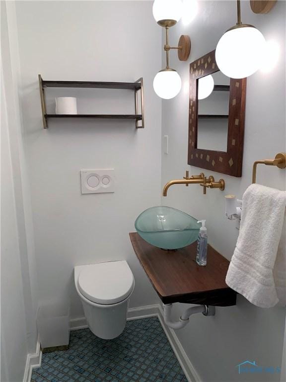 bathroom with sink and toilet