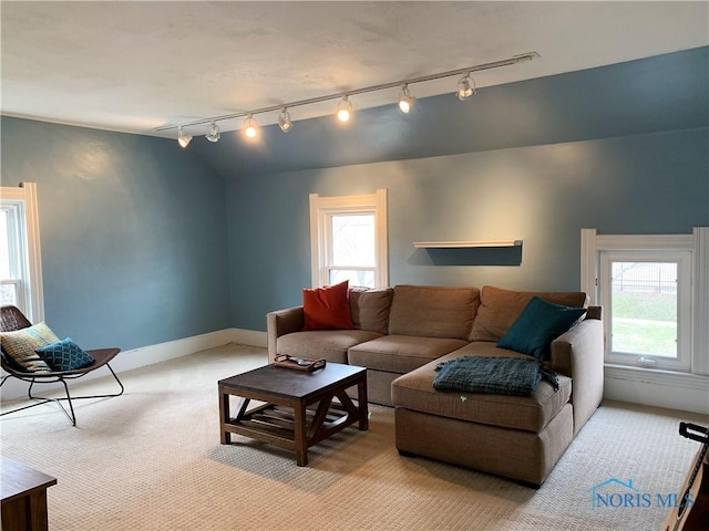 living room with light colored carpet and lofted ceiling