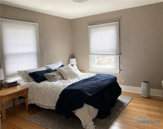 bedroom with light wood-type flooring