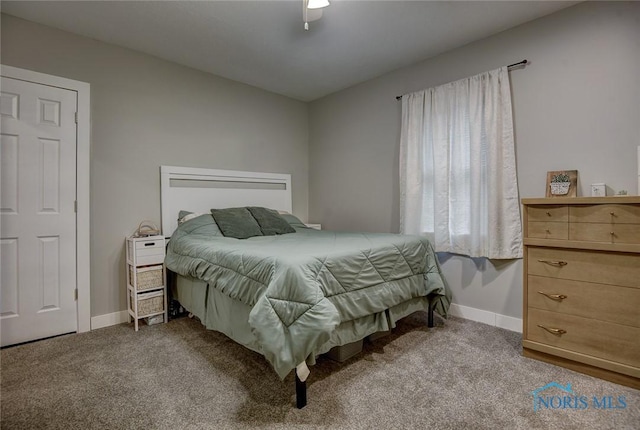 bedroom featuring light carpet and ceiling fan