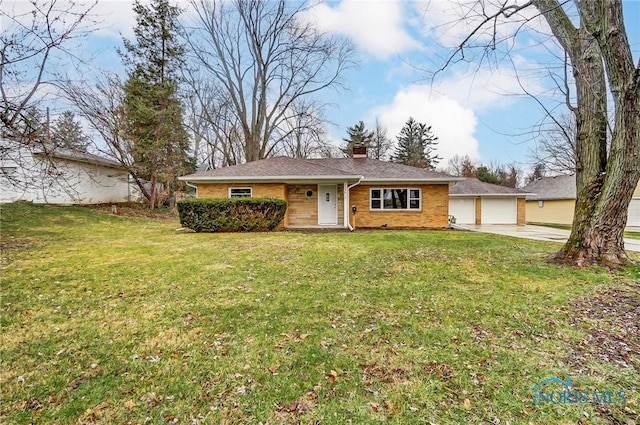 single story home featuring a garage and a front lawn