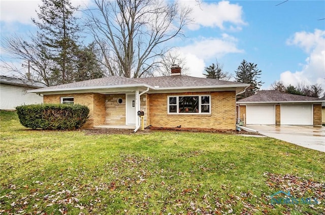 ranch-style home featuring an outbuilding, a front lawn, and a garage