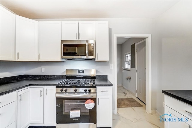 kitchen featuring white cabinetry and stainless steel appliances