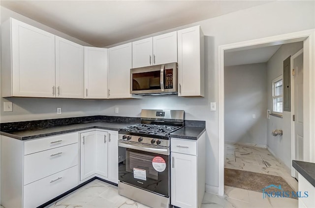 kitchen featuring white cabinetry and appliances with stainless steel finishes