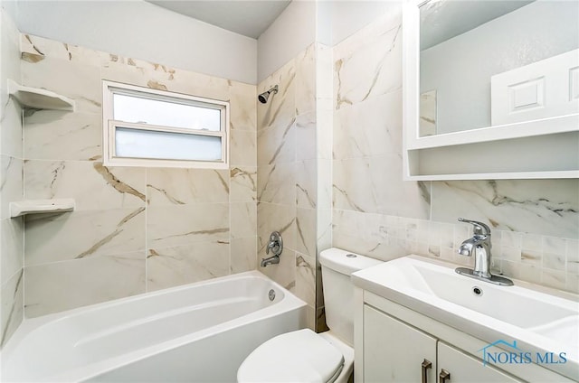 full bathroom featuring decorative backsplash, toilet, vanity, and tiled shower / bath combo