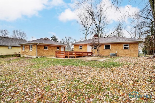 back of property with central air condition unit, a patio, and a deck