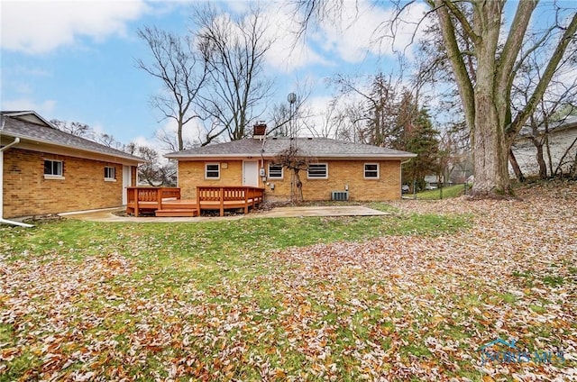 back of property featuring a patio area, a yard, central AC unit, and a deck