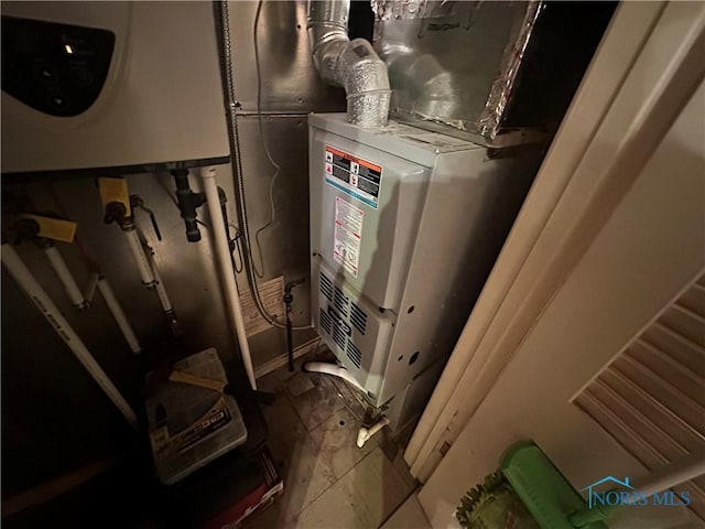 utility room with water heater