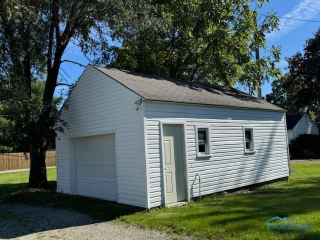 garage featuring a yard