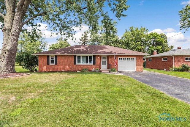 ranch-style house with a front yard and a garage