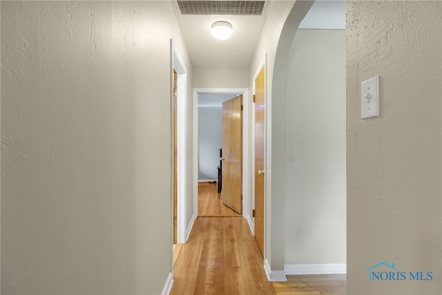 corridor featuring light hardwood / wood-style flooring