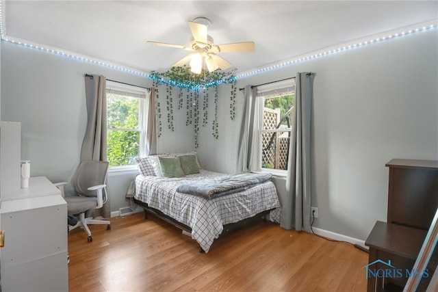 bedroom featuring ceiling fan and light wood-type flooring