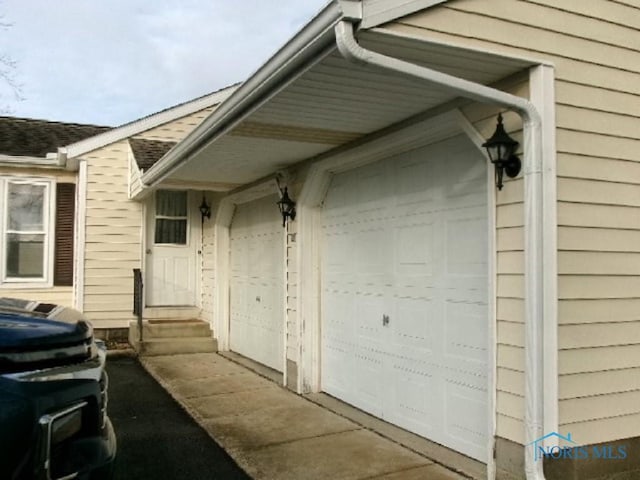 property entrance with a garage