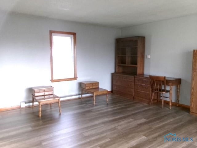 unfurnished room with dark hardwood / wood-style floors