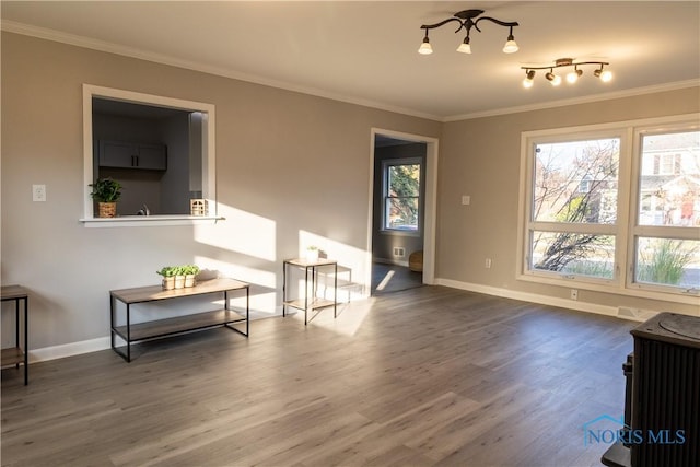 living room featuring hardwood / wood-style flooring and ornamental molding