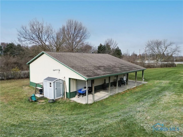 view of outbuilding with a lawn