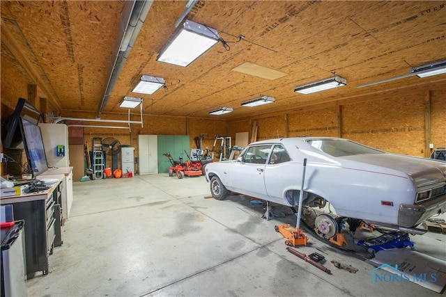 garage with a workshop area