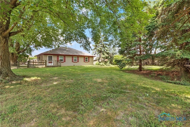 view of yard with a wooden deck