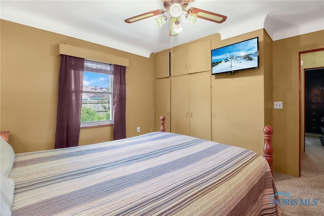 bedroom with carpet flooring, ceiling fan, and a closet