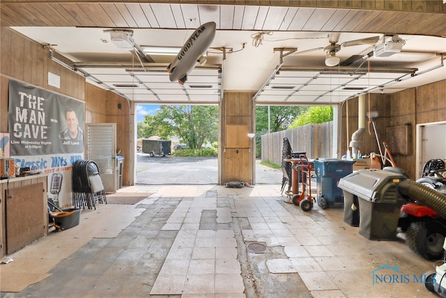 garage featuring wooden walls