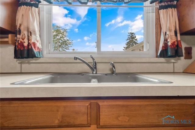 kitchen featuring sink and a healthy amount of sunlight