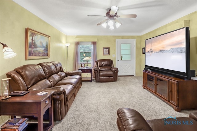 living room featuring light carpet and ceiling fan