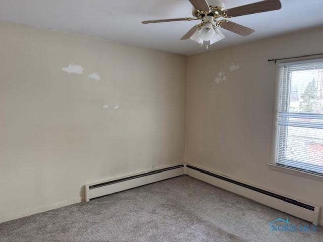 spare room featuring ceiling fan and light colored carpet