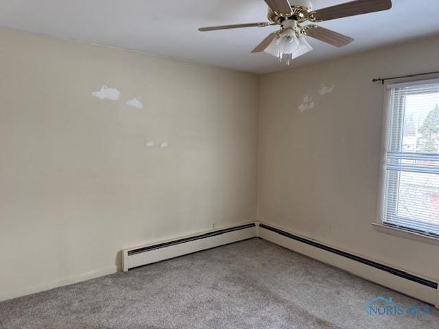 spare room featuring ceiling fan and light colored carpet