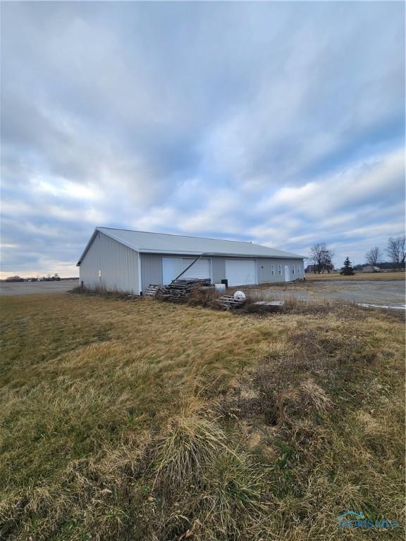 view of outdoor structure featuring a rural view