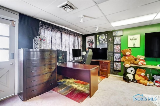 carpeted home office featuring a paneled ceiling