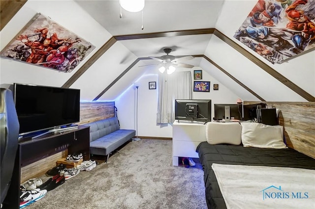 carpeted bedroom featuring ceiling fan and vaulted ceiling