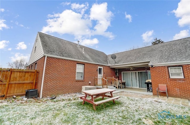 rear view of property with ceiling fan, central air condition unit, and a patio